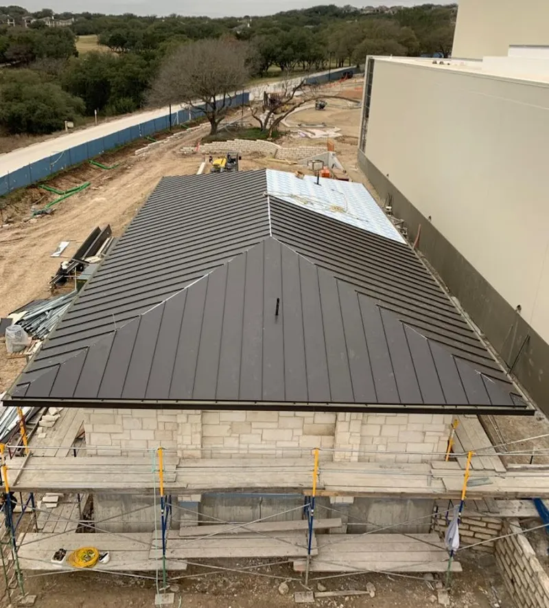 Metal roof new construction with scaffolding in Darien